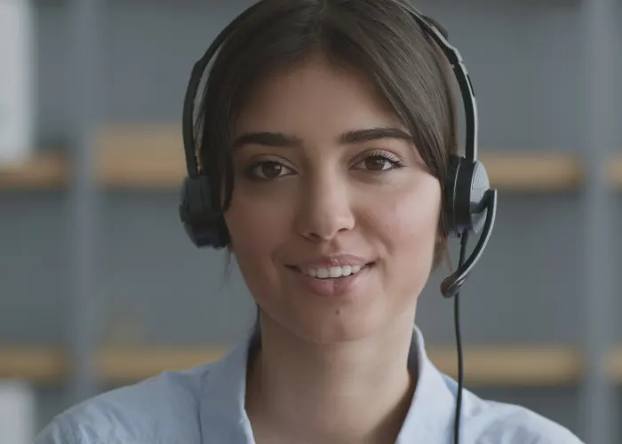AI B2B SaaS Customer Service - Image is a young woman in a blue shirt